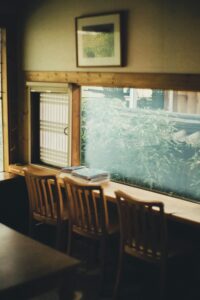 A cosy cafe interior with a window view